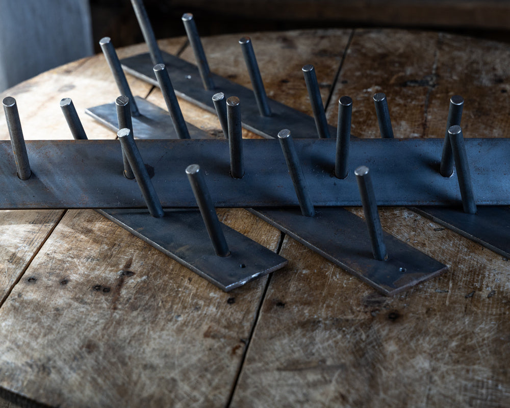Knaggrekke av jern 11 knagger