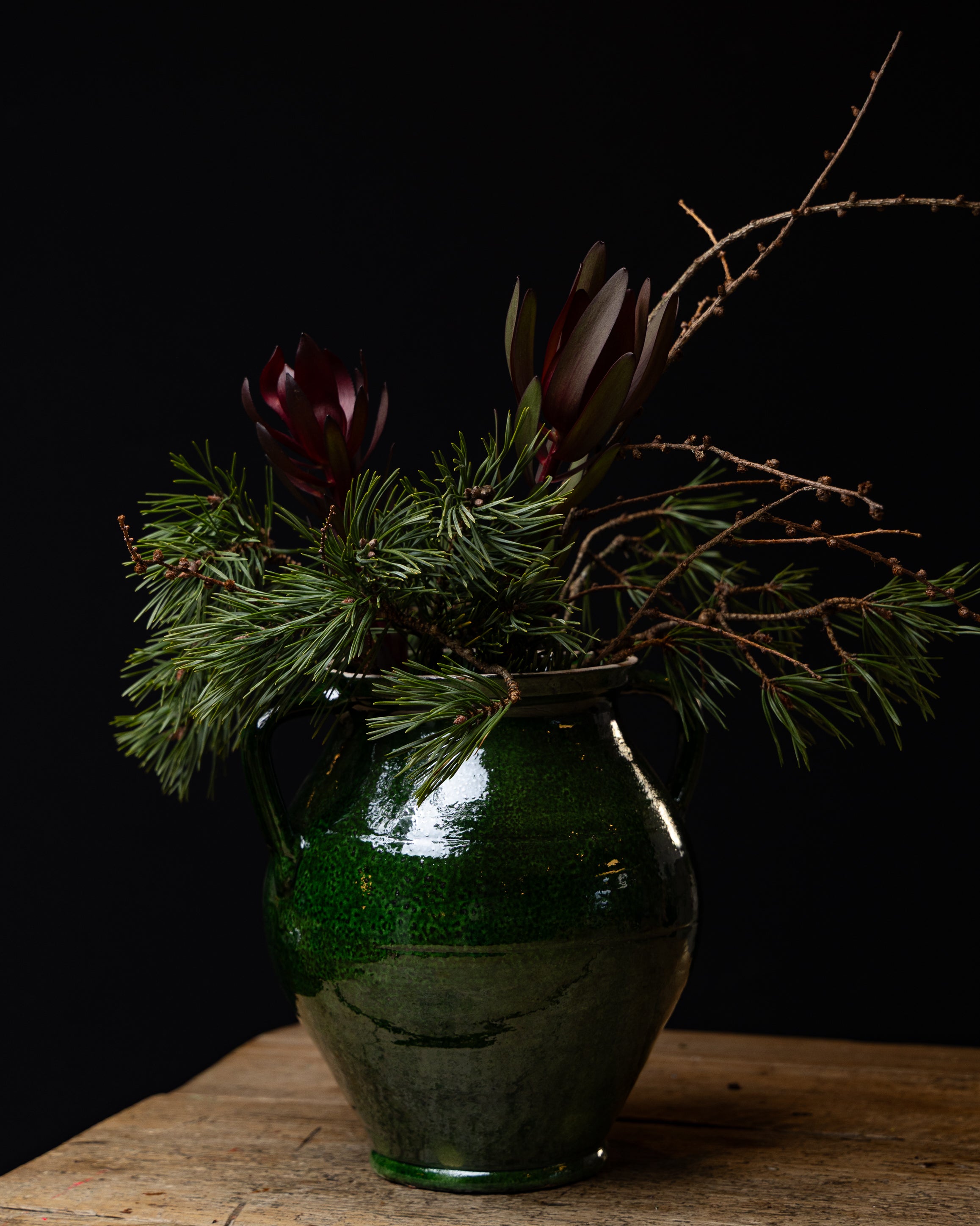 Grønn glasert krukke