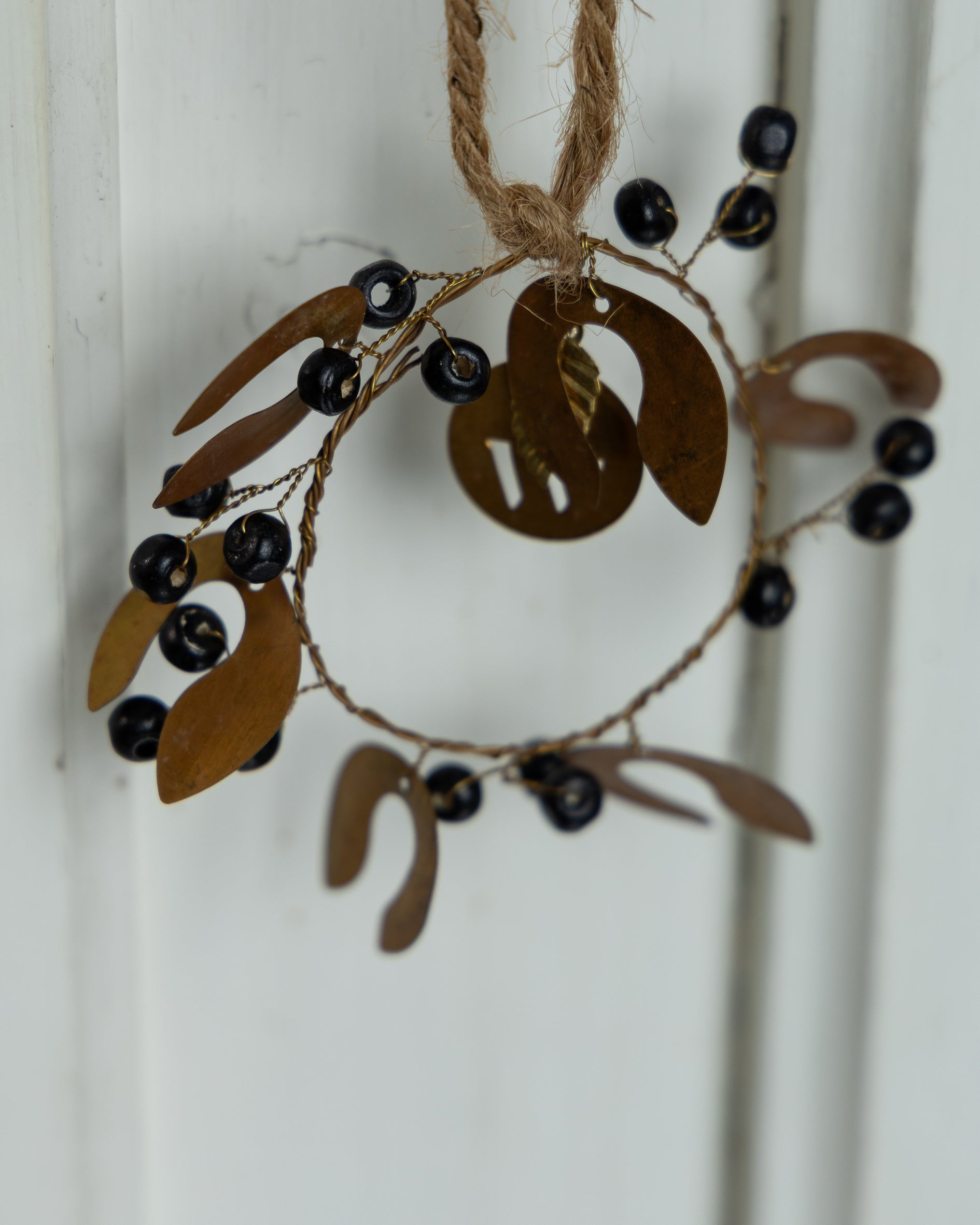 Serviettring med sorte treperler