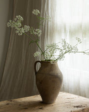 terrakotta-krukke-med-lys-blomst-oppi